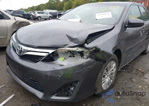 2014 Toyota Camry Le z USA, uszkodzony, nr VIN 4T1BF1FK5EU394015